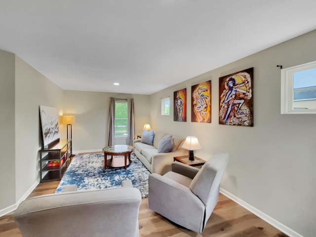 4315 Astoria Ave SE, Grand Rapids, MI 49512 - living room featuring light wood finished floors, baseboards, and recessed lighting