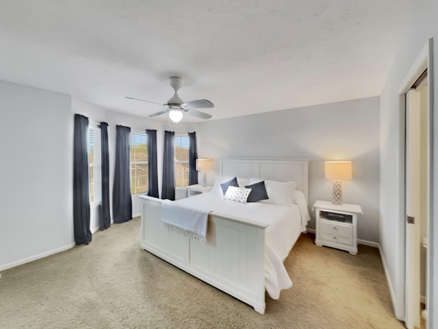 4315 Astoria Ave SE, Grand Rapids, MI 49512 - bedroom with light carpet, baseboards, and a ceiling fan