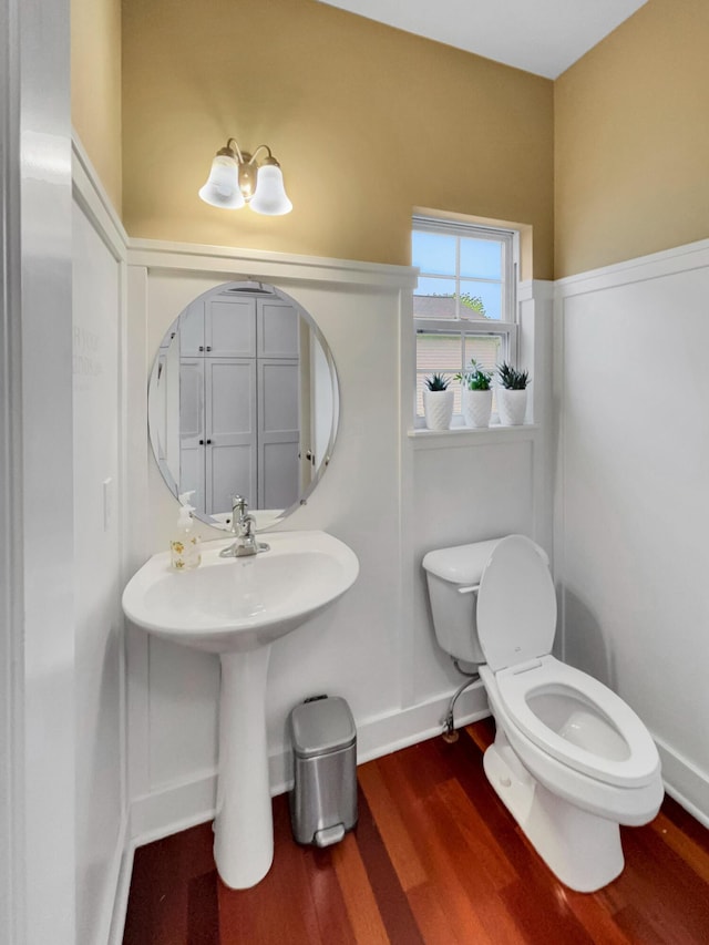 4315 Astoria Ave SE, Grand Rapids, MI 49512 - half bath with toilet and wood finished floors