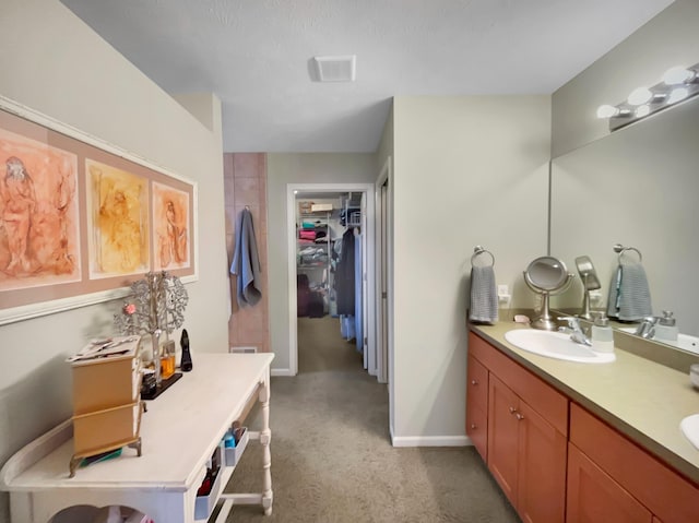 4315 Astoria Ave SE, Grand Rapids, MI 49512 - full bathroom featuring double vanity, a spacious closet, and baseboards