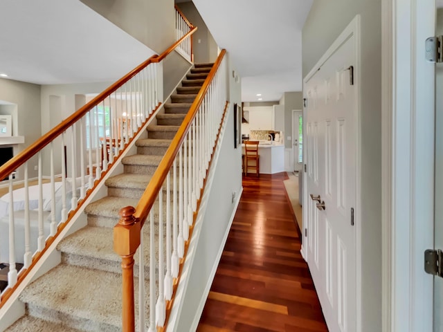 4315 Astoria Ave SE, Grand Rapids, MI 49512 - stairway with wood finished floors and recessed lighting