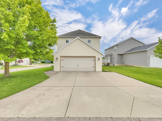 4315 Astoria Ave SE, Grand Rapids, MI 49512 - view of front of home with a garage, a front yard, and concrete driveway