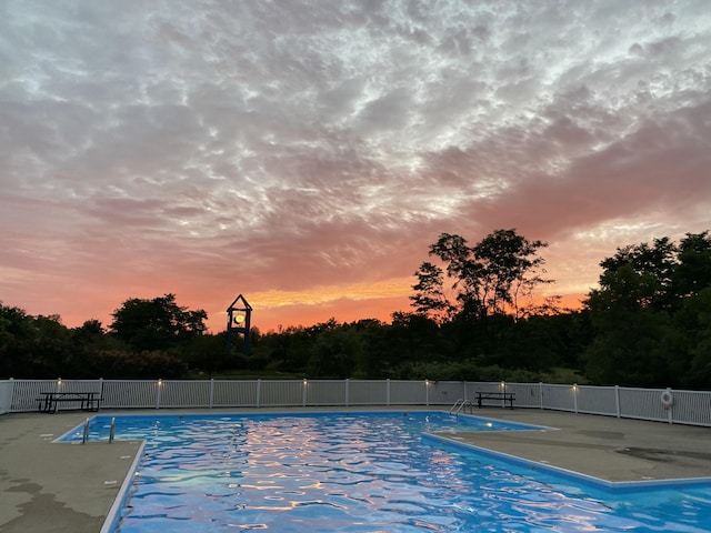 4315 Astoria Ave SE, Grand Rapids, MI 49512 - pool at dusk featuring a patio area