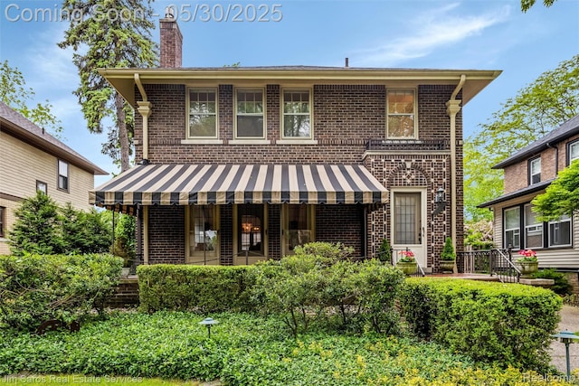 1377 Bishop Rd, Grosse Pointe Park, MI 48230 - back of house with brick siding and a chimney