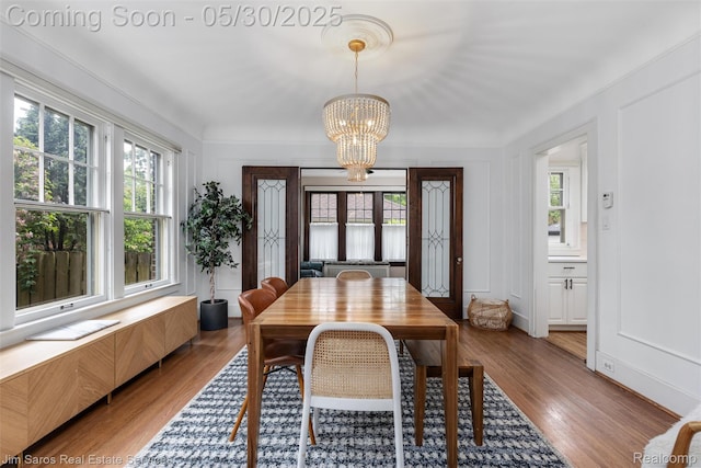 1377 Bishop Rd, Grosse Pointe Park, MI 48230 - dining space with a chandelier and light wood-type flooring