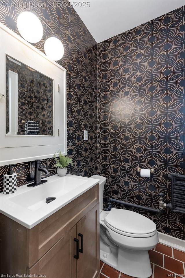 1377 Bishop Rd, Grosse Pointe Park, MI 48230 - bathroom featuring wallpapered walls, vanity, and toilet