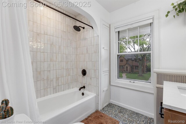 1377 Bishop Rd, Grosse Pointe Park, MI 48230 - full bathroom featuring shower / bath combo with shower curtain, vanity, baseboards, tile patterned floors, and toilet