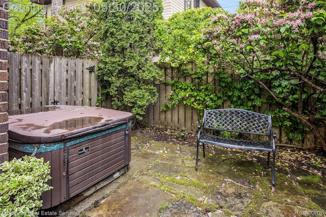 1377 Bishop Rd, Grosse Pointe Park, MI 48230 - fenced backyard with a hot tub and a patio