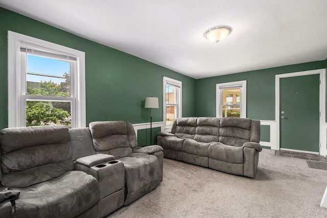 928 Baxter St SE, Grand Rapids, MI 49506 - living room featuring carpet floors and wainscoting