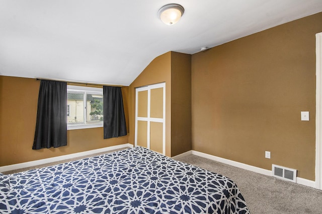 928 Baxter St SE, Grand Rapids, MI 49506 - bedroom featuring carpet floors, vaulted ceiling, and baseboards
