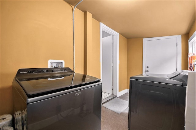 928 Baxter St SE, Grand Rapids, MI 49506 - laundry room featuring washer and clothes dryer, carpet flooring, and baseboards