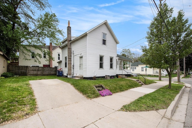 928 Baxter St SE, Grand Rapids, MI 49506 - view of property exterior with a chimney