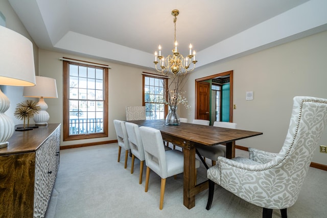 2184 Winters Way, Saint Joseph, MI 49085 - dining space with a chandelier, light colored carpet, baseboards, and a raised ceiling
