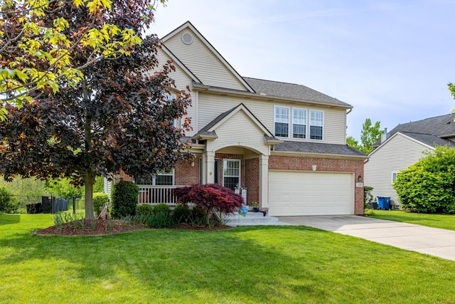 1743 Savannah Ln, Ypsilanti, MI 48198 - traditional-style home featuring a garage, concrete driveway, brick siding, and a front yard