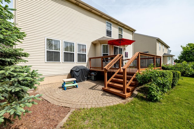 1743 Savannah Ln, Ypsilanti, MI 48198 - back of house featuring a patio, a wooden deck, and a yard