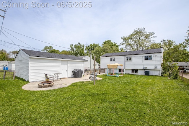 36335 Weideman St, Clinton Township, MI 48035 - rear view of house featuring a fire pit, a patio, an outbuilding, and central AC