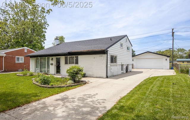 36335 Weideman St, Clinton Township, MI 48035 - view of front facade featuring brick siding, a garage, a chimney, and an outbuilding