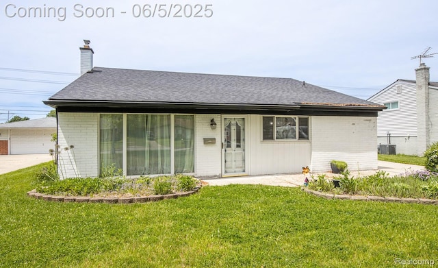 36335 Weideman St, Clinton Township, MI 48035 - single story home featuring brick siding, a front yard, cooling unit, a chimney, and roof with shingles