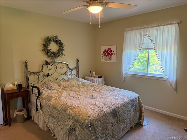 22693 Coachlight Cir, Taylor, MI 48180 - carpeted bedroom with baseboards and a ceiling fan