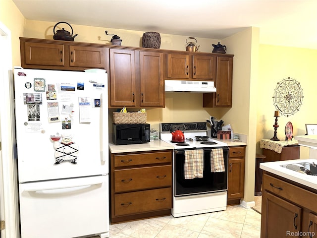 22693 Coachlight Cir, Taylor, MI 48180 - kitchen with freestanding refrigerator, electric range oven, under cabinet range hood, black microwave, and light countertops