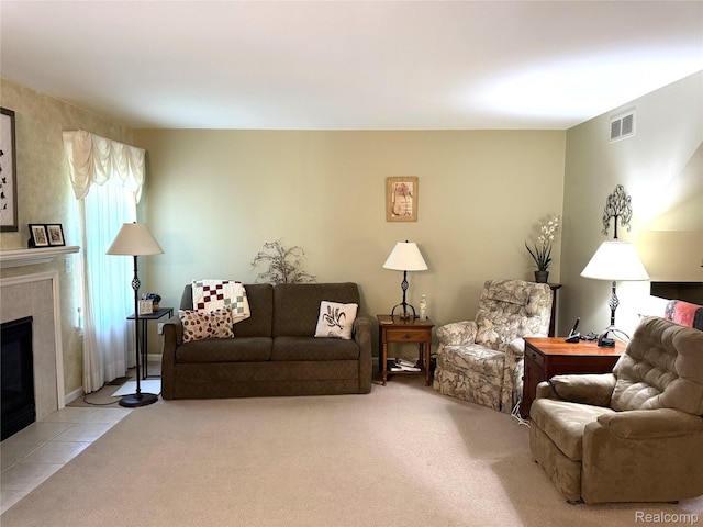 22693 Coachlight Cir, Taylor, MI 48180 - living area with a tiled fireplace and tile patterned floors