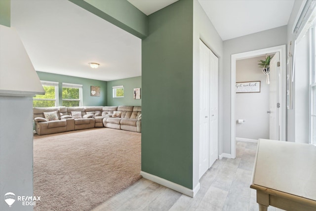 9416 Sunrise Ln, Davison, MI 48423 - hallway featuring baseboards and light wood finished floors