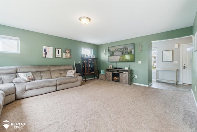 9416 Sunrise Ln, Davison, MI 48423 - living room with carpet floors, baseboards, and a fireplace