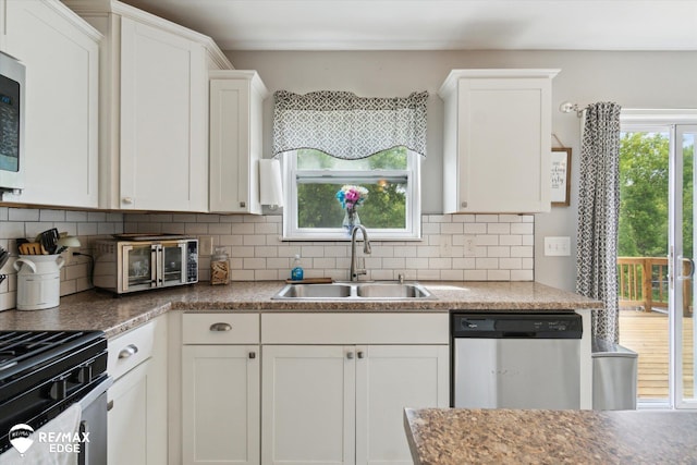 9416 Sunrise Ln, Davison, MI 48423 - kitchen featuring stainless steel appliances, a sink, white cabinets, and tasteful backsplash
