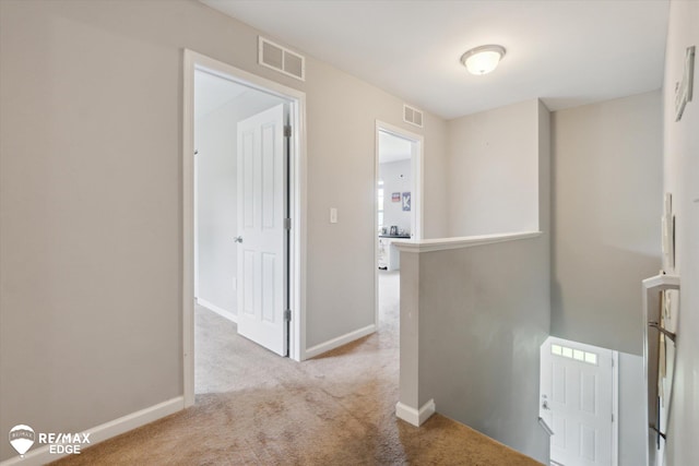 9416 Sunrise Ln, Davison, MI 48423 - hall featuring an upstairs landing, carpet, and baseboards