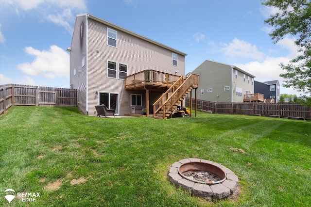 9416 Sunrise Ln, Davison, MI 48423 - back of property with stairway, an outdoor fire pit, a wooden deck, and a patio area