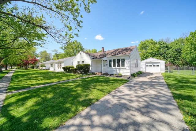 962 Vine St, Adrian, MI 49221 - view of front of property with driveway, an outdoor structure, a chimney, and a detached garage