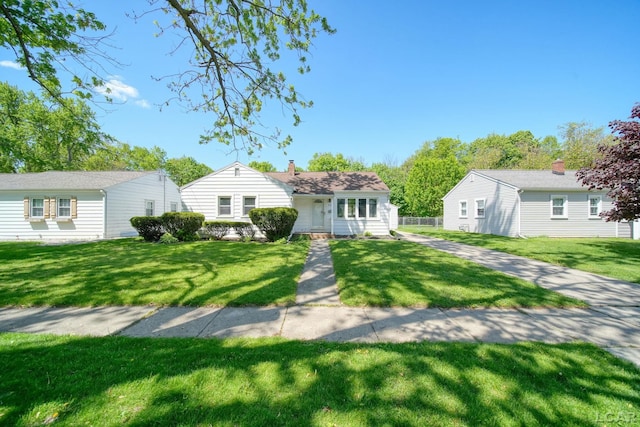 962 Vine St, Adrian, MI 49221 - view of front facade featuring a front yard and a chimney