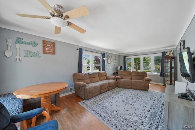 962 Vine St, Adrian, MI 49221 - living area with healthy amount of natural light, wood finished floors, and baseboards