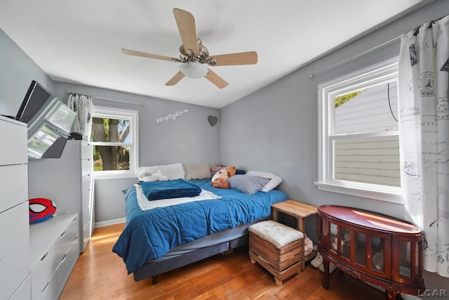 962 Vine St, Adrian, MI 49221 - bedroom with wood finished floors and ceiling fan