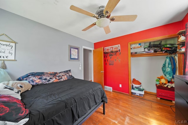 962 Vine St, Adrian, MI 49221 - bedroom featuring wood finished floors, a ceiling fan, and baseboards