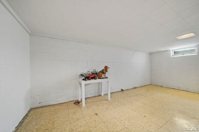 962 Vine St, Adrian, MI 49221 - below grade area featuring tile patterned floors and concrete block wall