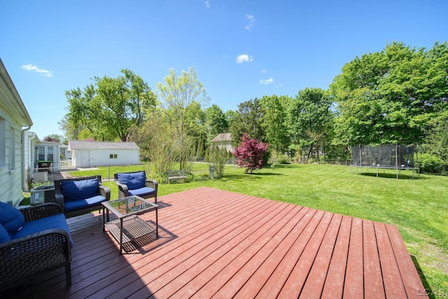 962 Vine St, Adrian, MI 49221 - deck featuring a trampoline and an outdoor living space