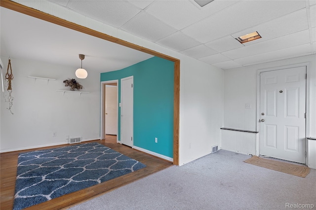 717 N Vermont Ave, Royal Oak, MI 48067 - spare room featuring a paneled ceiling, wood finished floors, and baseboards