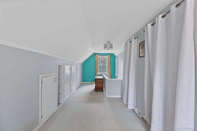 717 N Vermont Ave, Royal Oak, MI 48067 - corridor with light colored carpet, baseboards, and vaulted ceiling