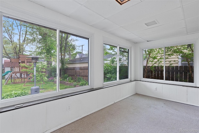 717 N Vermont Ave, Royal Oak, MI 48067 - unfurnished sunroom with carpet floors, plenty of natural light, and a drop ceiling