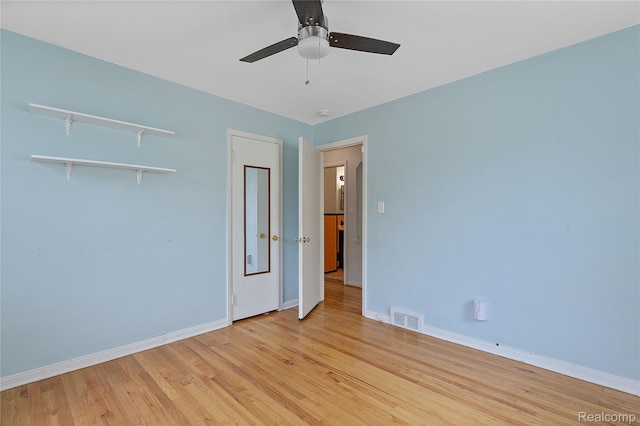 717 N Vermont Ave, Royal Oak, MI 48067 - unfurnished bedroom with baseboards, light wood finished floors, and a ceiling fan