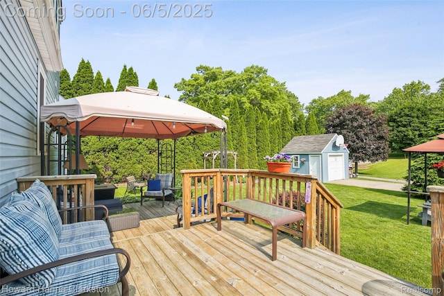 3414 Gregory Rd, Lake Orion, MI 48359 - deck featuring a gazebo, a yard, an outbuilding, and a detached garage