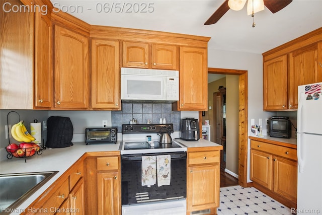 3414 Gregory Rd, Lake Orion, MI 48359 - kitchen featuring white appliances, a sink, a ceiling fan, light countertops, and decorative backsplash