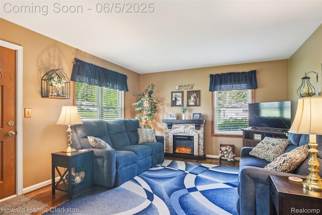 3414 Gregory Rd, Lake Orion, MI 48359 - living room featuring healthy amount of natural light, wood finished floors, a fireplace, and baseboards