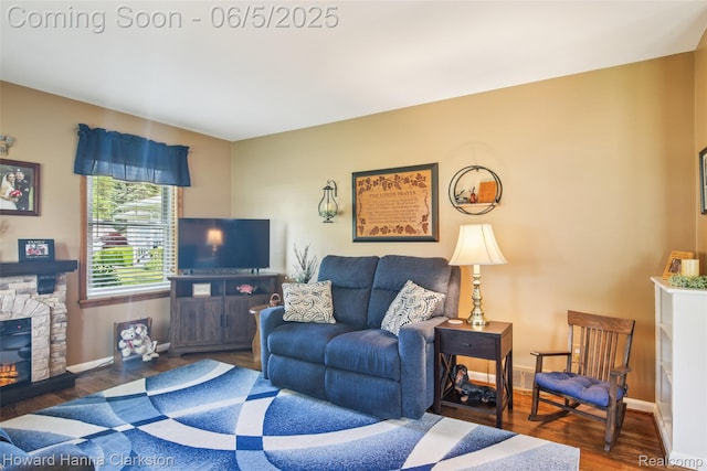 3414 Gregory Rd, Lake Orion, MI 48359 - living room featuring wood finished floors, baseboards, and a fireplace