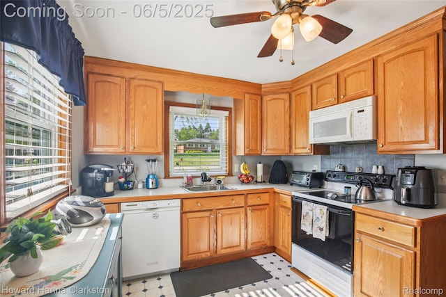 3414 Gregory Rd, Lake Orion, MI 48359 - kitchen with white appliances, a sink, light countertops, light floors, and backsplash