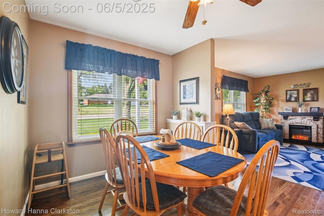 3414 Gregory Rd, Lake Orion, MI 48359 - dining space with wood finished floors, plenty of natural light, a fireplace, and a ceiling fan