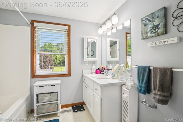 3414 Gregory Rd, Lake Orion, MI 48359 - full bath featuring vanity, baseboards, and tub / shower combination