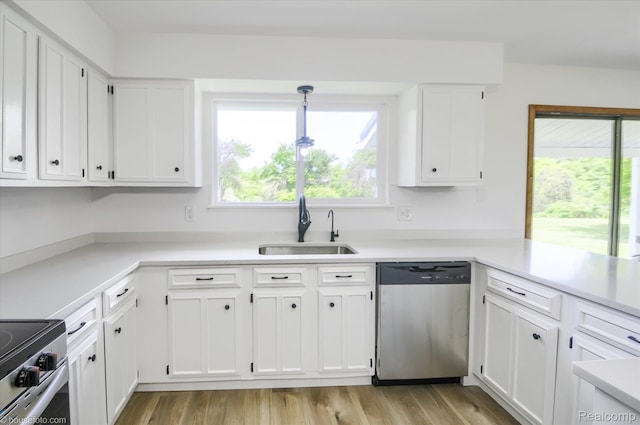 2680 N Lake George Rd, Metamora, MI 48455 - kitchen featuring stainless steel appliances, a sink, white cabinetry, and plenty of natural light