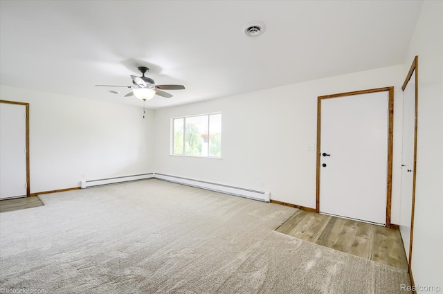 2680 N Lake George Rd, Metamora, MI 48455 - unfurnished room featuring ceiling fan, carpet flooring, baseboards, and a baseboard heating unit